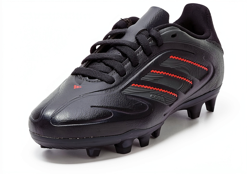 adidas junior soccer cleats on a grass field